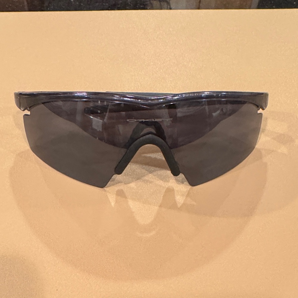 Oakley Smoke Lens Wraparound Sunglasses with Translucent Gray Frame